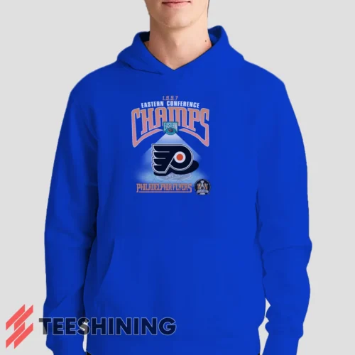 Male model showcasing the 1997 Philadelphia Flyers NHL Hockey Men's Hoodie in royal blue. This ultra-cozy pullover hoodie is designed for warmth and everyday versatility.