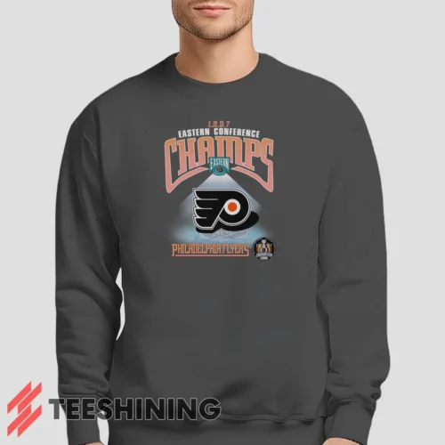 Male model lounging in the 1997 Philadelphia Flyers NHL Hockey Men's Sweatshirt in charcoal. Made from ultra-soft fabric for unmatched comfort.