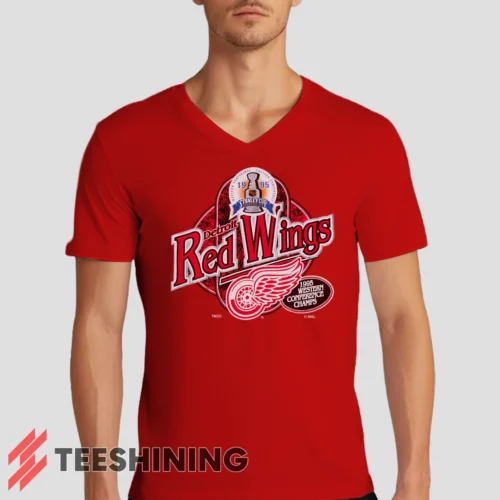 Male model rocking the 90s Detroit Red Wings Western Conference Champs Vintage Hockey Fan Men's V-Neck T-Shirt in red. Featuring a modern V-neck cut, perfect for a stylish yet casual look.