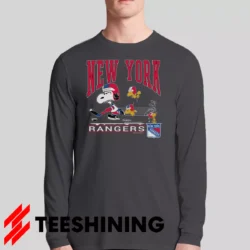 Male model sporting the 90s New York Rangers Snoopy Peanuts NHL Hockey Vintage Fan Men's Long Sleeve T-Shirt in charcoal. Lightweight and breathable, ideal for transitional weather.