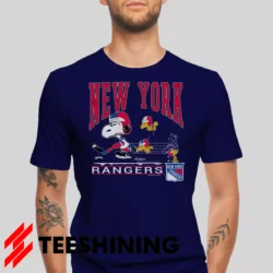 Male model wearing the 90s New York Rangers Snoopy Peanuts NHL Hockey Vintage Fan Men's T-Shirt in navy. Crafted from ultra-soft cotton, this classic crew neck tee offers breathable comfort and effortless style.