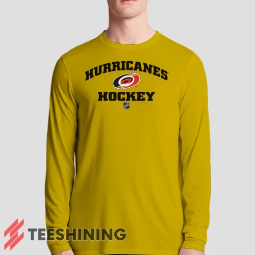 Male model sporting the Carolina Hurricanes NHL Hockey Men's Long Sleeve T-Shirt in yellow. Lightweight and breathable, ideal for transitional weather.
