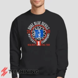 Male model lounging in the Duke Blue Devils 2001 Nation Champions Ncaa Men's Sweatshirt in black. Made from ultra-soft fabric for unmatched comfort.
