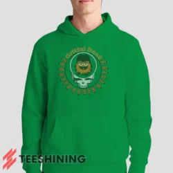Male model showcasing the Grateful Dead Gritty Philadelphia Flyers Men's Hoodie in irish green. This ultra-cozy pullover hoodie is designed for warmth and everyday versatility.
