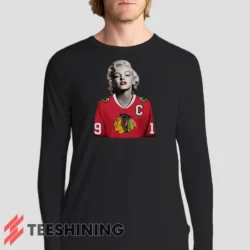 Male model sporting the Marilyn Monroe Chicago Blackhawks Unique Hockey Fan Men's Long Sleeve T-Shirt in black. Lightweight and breathable, ideal for transitional weather.