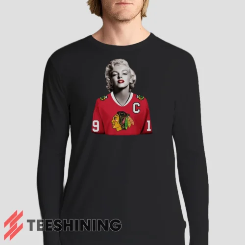 Male model sporting the Marilyn Monroe Chicago Blackhawks Unique Hockey Fan Men's Long Sleeve T-Shirt in black. Lightweight and breathable, ideal for transitional weather.
