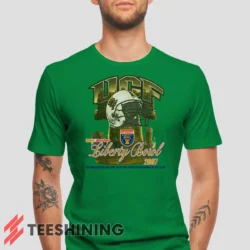 Male model wearing the UCF Golden Knights 2007 Liberty Bowl Men's T-Shirt in irish green. Crafted from ultra-soft cotton, this classic crew neck tee offers breathable comfort and effortless style.