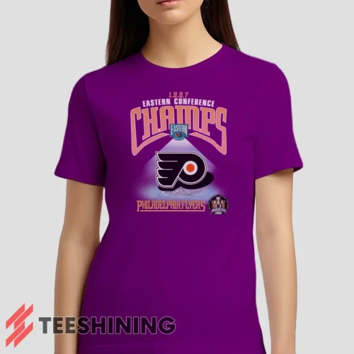 Female model wearing the 1997 Philadelphia Flyers NHL Hockey Women's T-Shirt in purple. Crafted from ultra-soft cotton, this classic crew neck tee offers breathable comfort and effortless style.