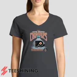 Female model rocking the 1997 Philadelphia Flyers NHL Hockey Women's V-Neck T-Shirt in charcoal. Featuring a modern V-neck cut, perfect for a stylish yet casual look.