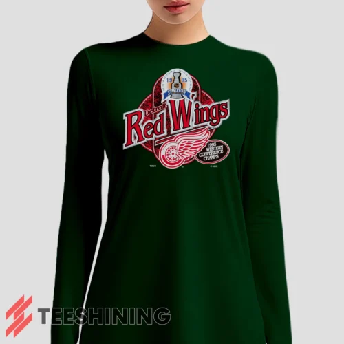 Female model sporting the 90s Detroit Red Wings Western Conference Champs Vintage Hockey Fan Women's Long Sleeve T-Shirt in forest green. Lightweight and breathable, ideal for transitional weather.