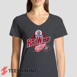 Female model rocking the 90s Detroit Red Wings Western Conference Champs Vintage Hockey Fan Women's V-Neck T-Shirt in charcoal. Featuring a modern V-neck cut, perfect for a stylish yet casual look.