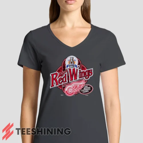 Female model rocking the 90s Detroit Red Wings Western Conference Champs Vintage Hockey Fan Women's V-Neck T-Shirt in charcoal. Featuring a modern V-neck cut, perfect for a stylish yet casual look.
