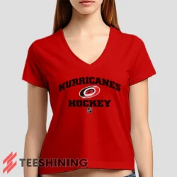 Female model rocking the Carolina Hurricanes NHL Hockey Women's V-Neck T-Shirt in red. Featuring a modern V-neck cut, perfect for a stylish yet casual look.