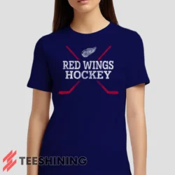 Female model wearing the Detroit Red Wings Hockey Women's T-Shirt in navy. Crafted from ultra-soft cotton, this classic crew neck tee offers breathable comfort and effortless style.