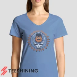 Female model rocking the Grateful Dead Gritty Philadelphia Flyers Women's V-Neck T-Shirt in light blue. Featuring a modern V-neck cut, perfect for a stylish yet casual look.