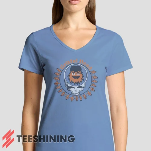 Female model rocking the Grateful Dead Gritty Philadelphia Flyers Women's V-Neck T-Shirt in light blue. Featuring a modern V-neck cut, perfect for a stylish yet casual look.