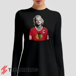 Female model sporting the Marilyn Monroe Chicago Blackhawks Unique Hockey Fan Women's Long Sleeve T-Shirt in black. Lightweight and breathable, ideal for transitional weather.