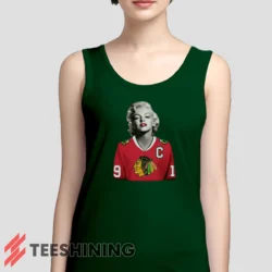 Female model wearing the Marilyn Monroe Chicago Blackhawks Unique Hockey Fan Women's Tank Top in forest green. A perfect blend of comfort and breathability for workouts or summer days.