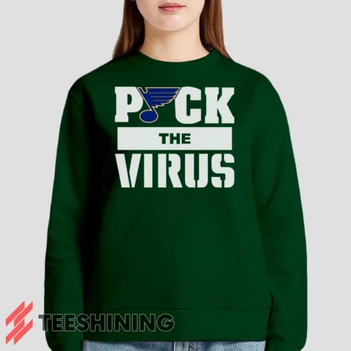 Female model lounging in the St Louis Blues Jets Puck The Virus Women's Sweatshirt in forest green. Made from ultra-soft fabric for unmatched comfort.