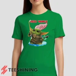 Female model wearing the Star Wars Baby Yoda Detroit Red Wings Fun NHL Sci - Fi Fan Women's T-Shirt in irish green. Crafted from ultra-soft cotton, this classic crew neck tee offers breathable comfort and effortless style.