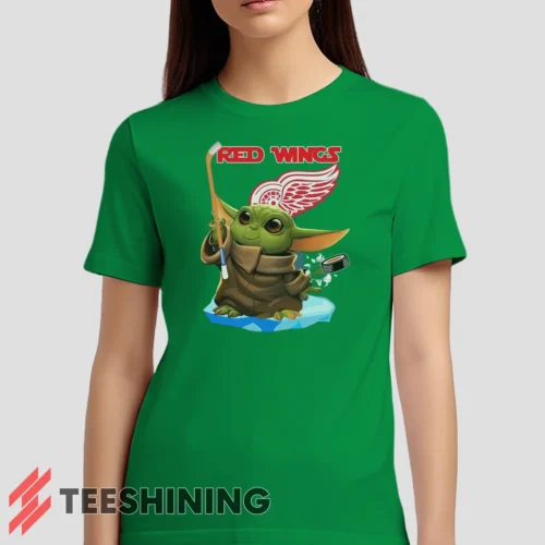 Female model wearing the Star Wars Baby Yoda Detroit Red Wings Fun NHL Sci - Fi Fan Women's T-Shirt in irish green. Crafted from ultra-soft cotton, this classic crew neck tee offers breathable comfort and effortless style.