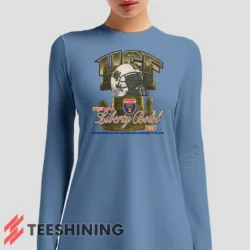 Female model sporting the UCF Golden Knights 2007 Liberty Bowl Women's Long Sleeve T-Shirt in light blue. Lightweight and breathable, ideal for transitional weather.
