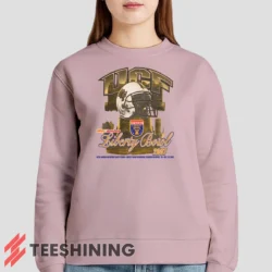 Female model lounging in the UCF Golden Knights 2007 Liberty Bowl Women's Sweatshirt in light pink. Made from ultra-soft fabric for unmatched comfort.