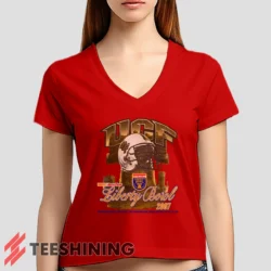 Female model rocking the UCF Golden Knights 2007 Liberty Bowl Women's V-Neck T-Shirt in red. Featuring a modern V-neck cut, perfect for a stylish yet casual look.